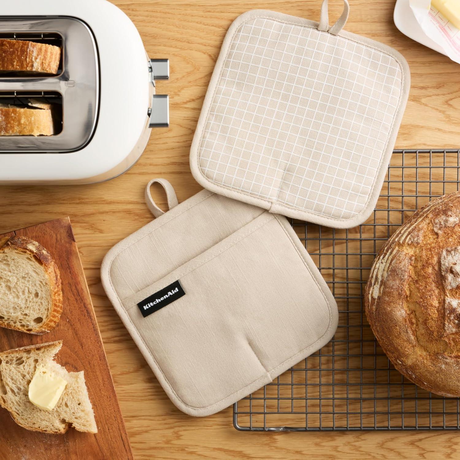 imageKITCHENAID Gourmet Series Gridlines Pot Holders 2Pack Set Heat Resistant up to 600F Soft Silicone Grip Magnetic Cuff Ink Blue 8quotx8quotMilkshake Tan