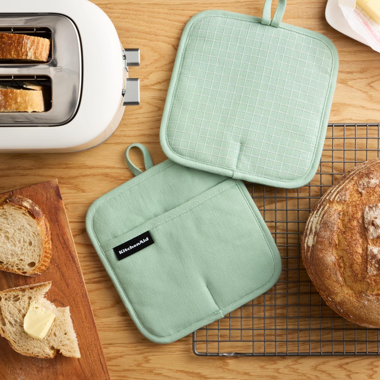 imageKITCHENAID Gourmet Series Gridlines Pot Holders 2Pack Set Heat Resistant up to 600F Soft Silicone Grip Magnetic Cuff Ink Blue 8quotx8quotPistachio Green